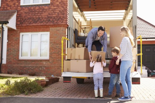 Removal van and moving team in Wembley outside local residential flats