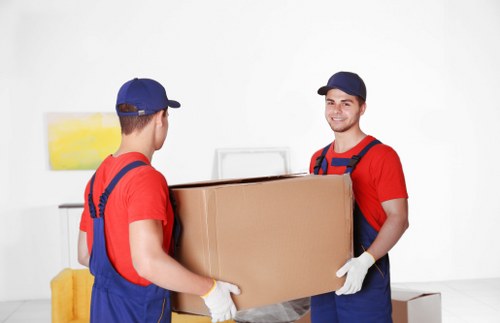 Packed boxes and furniture ready for removal services in Wembley