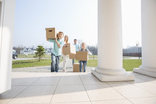 Furniture removals service planning in Wembley with moving van and boxed items