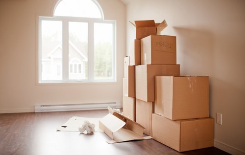 Movers transporting household items with care in Wembley
