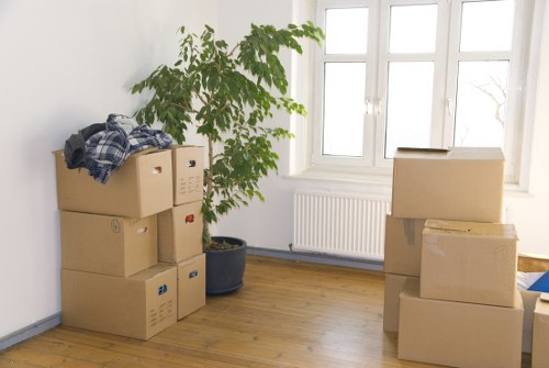 Removalists in Wembley carefully packing household items for relocation