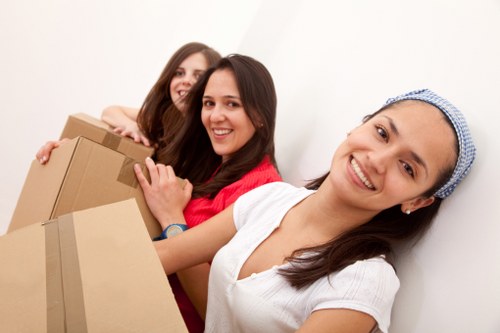 Loading household furniture into a removal van in Wembley