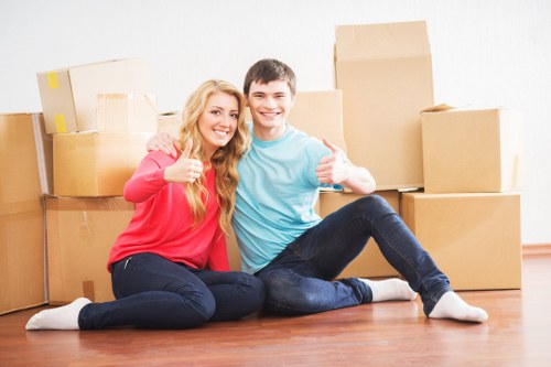 Professional movers handling furniture in Wembley
